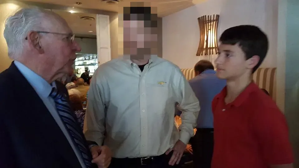 Picture posted to Facebook in August 2015 showing a young Andrew Nary (right) meeting with right-wing evangelical pastor Rafael Cruz (left). Face blurred by Decoherence Media.